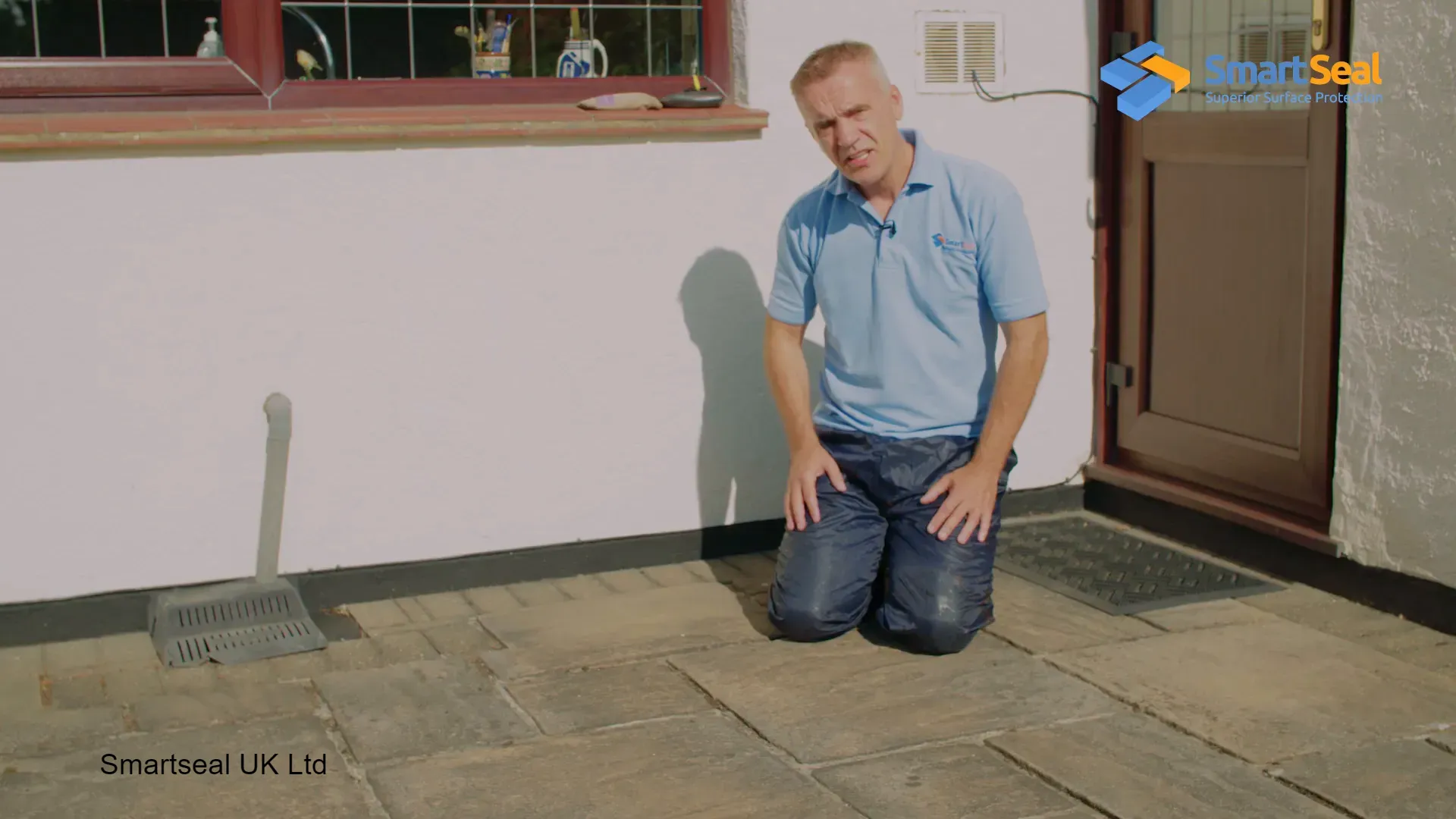 Examining the condition of the paving slabs before cleaning